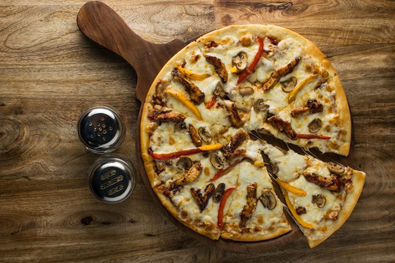 BBQ Chicken round table pizza with smoky barbecue sauce